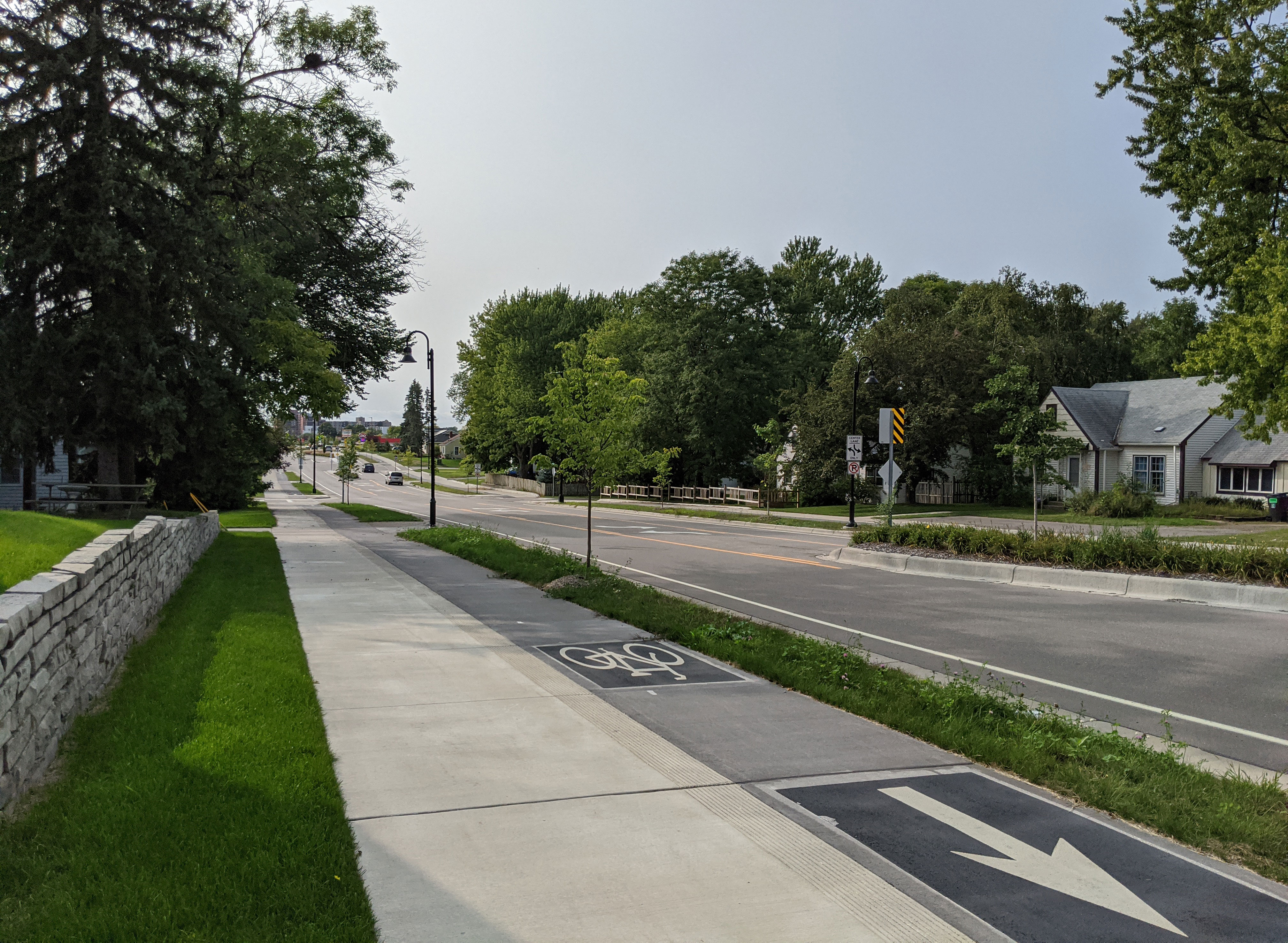 66th Street in Richfield, showing a four-to-three lane conversion with separate sidewalks and sidewalk-level protected bike lanes.